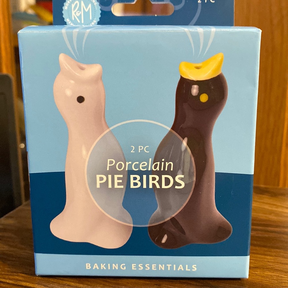 New in original box.Porcelain Pie Birds! One for the pumpkin,one for the apple!